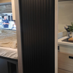 Roller door for bathrooms and toilets with mounting rails